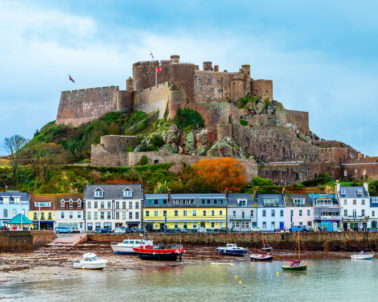 Mount Orgueil castle over the Gorey village promenade with yachts on the shore, Saint Martin, bailiwick of Jersey, Channel Islands, Great Britain
